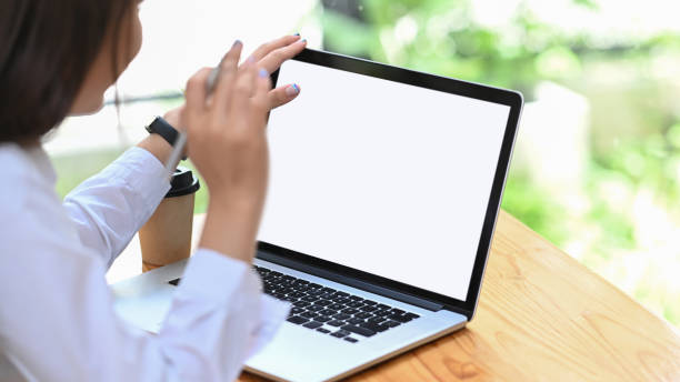 istock Businesswoman reading information on laptop computer. 1328612883
