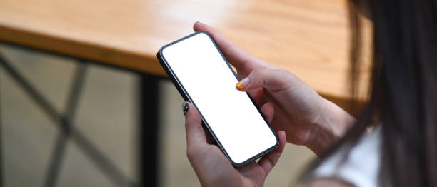 istock Mock up image of businesswoman using smart phone. 1328612928