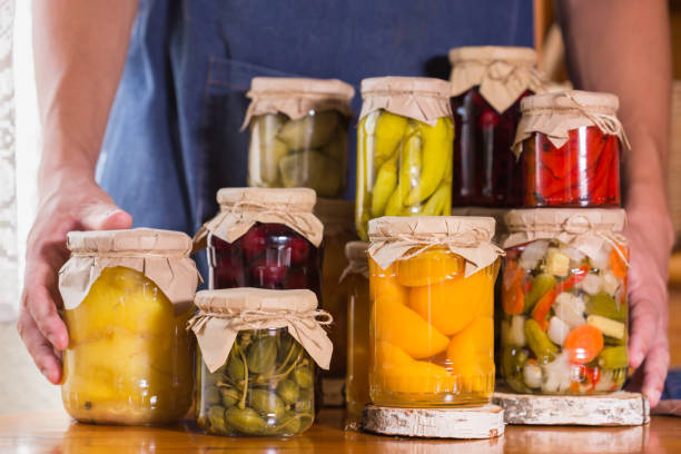 istock Young man holding in hands preserved food 1328616872