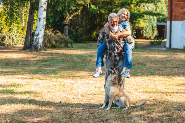 istock Senior couple having fun in countryside 1328619001