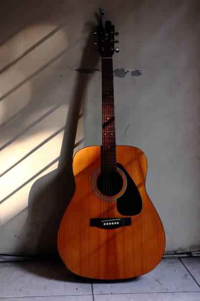 istock a guitar on the wall in the sun 1328620258