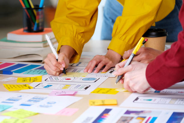 istock Brainstorm planing creative teamwork,  Close up of hands mobile phone app developer team meeting about screen display prototype layout for smartphone, ui, ux concept 1328621429