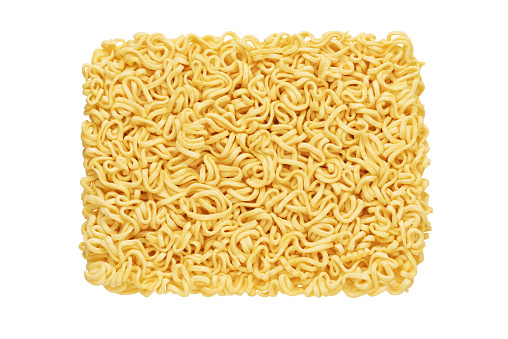 Dry raw instant noodles isolated on white background. Top view.