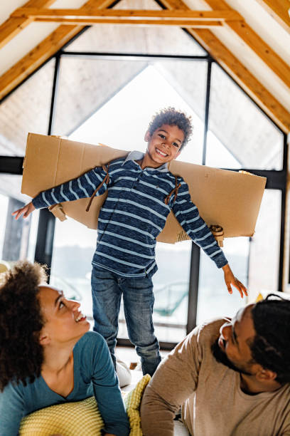 istock Mommy, daddy, I'm an airplane! 1328623450