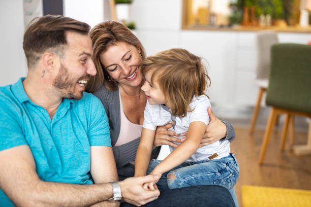 istock Young happy family talking at home. 1328623746