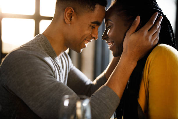istock Affectionate African American couple at home. 1328624906