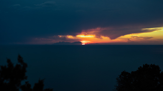 Glowing sunrise shines over mountain range. Exploration, inspiration concept.
