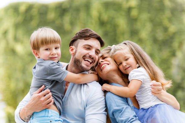 istock Young happy family spending time in nature. 1328625817