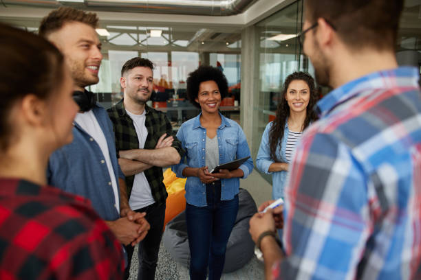 istock Multi-ethnic business colleagues having brainstorming session in the office 1328626365