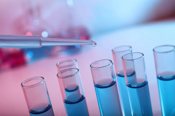 istock Dripping reagent into test tube with blue liquid, closeup. Laboratory analysis 1328629497