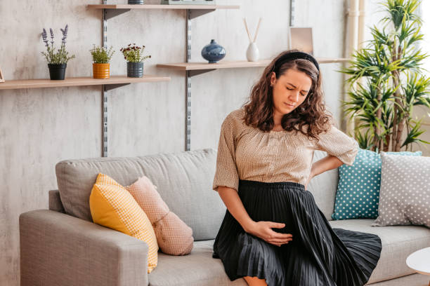 istock Young pregnant woman suffering from backache 1328629684