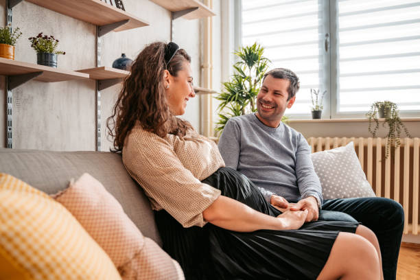 istock Husband holding hands with his pregnant wife 1328630892