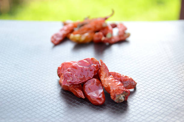 Fresh red juicy chili peppers in a cut on round rings isolated on white background