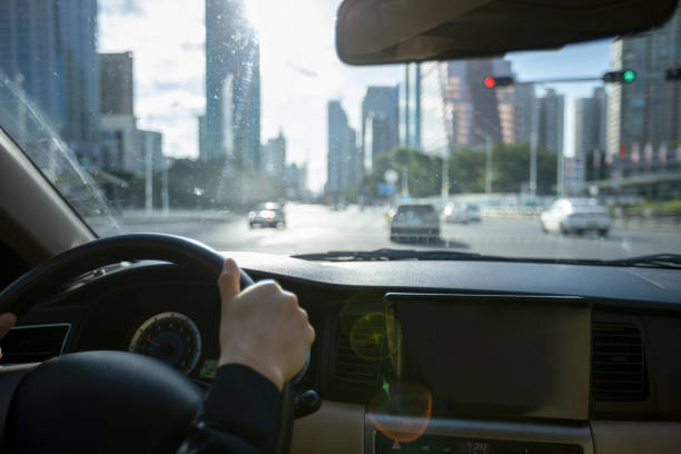 istock Driving car in modern city 1328634707