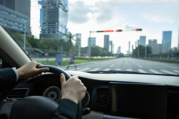 istock Driving car in modern city 1328635680