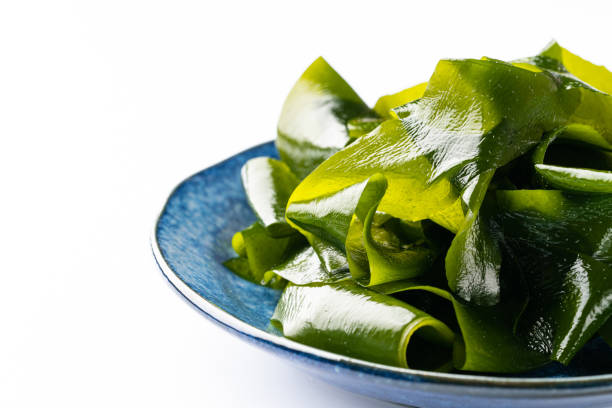 istock Wakame seaweed on white background 1328636553