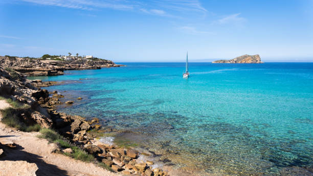 istock Sailboat on crystal clear waters in a paradise coast 1328638452