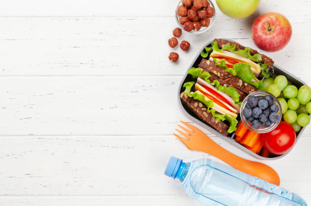 istock Healthy school lunch box with sandwich and fresh vegetables 1328638463