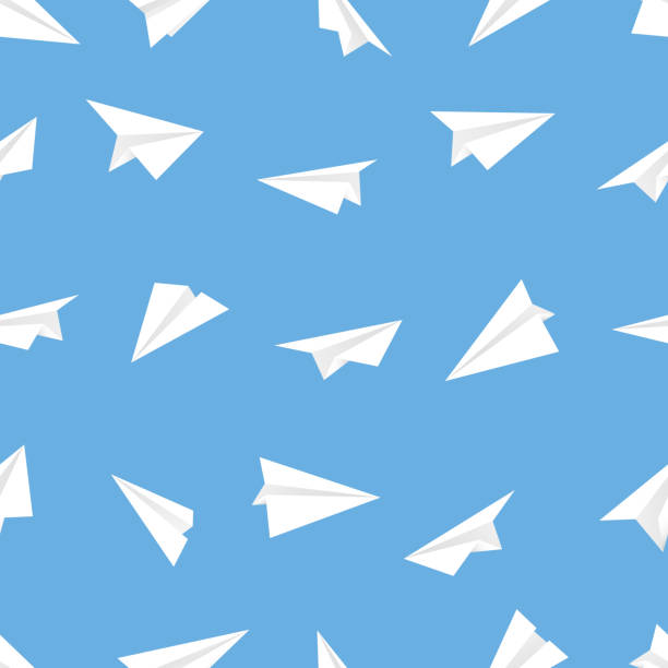 istock White airplanes on pattern layout. Seamless mockup of with paper planes aircraft on blue background 1328640392
