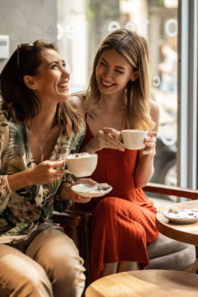 istock Two cheerful women having fun during coffee time 1328641918