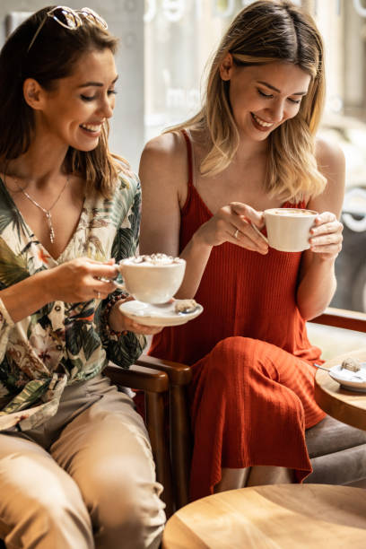 istock Two cheerful women having fun during coffee time 1328641941