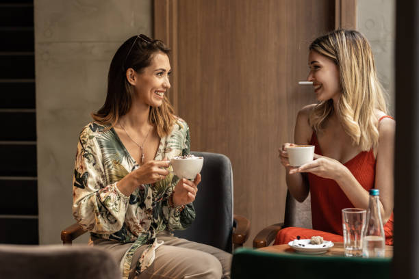 istock Relaxing women enjoying coffee together 1328642016