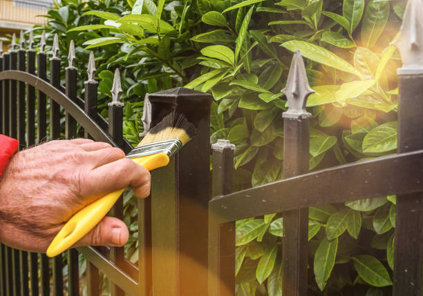 istock painting fence 1328642033