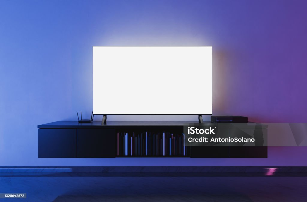 modern tv on living room front view of a white backlit television mockup in a living room with blue and red lighting. 3d render Television Industry Stock Photo