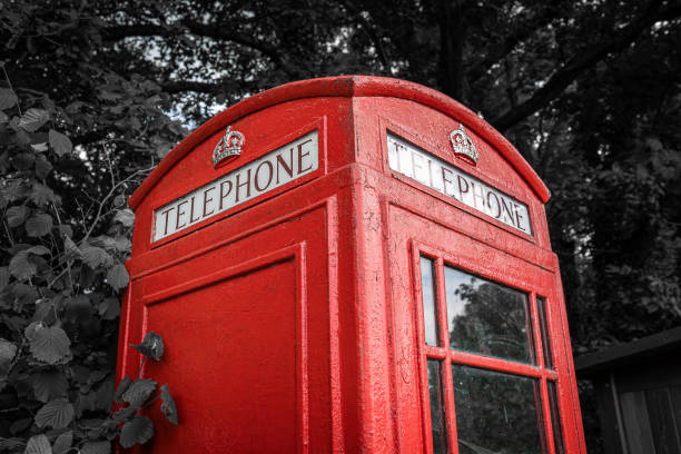 istock Traditional old red British telephone box, selective color 1328643210