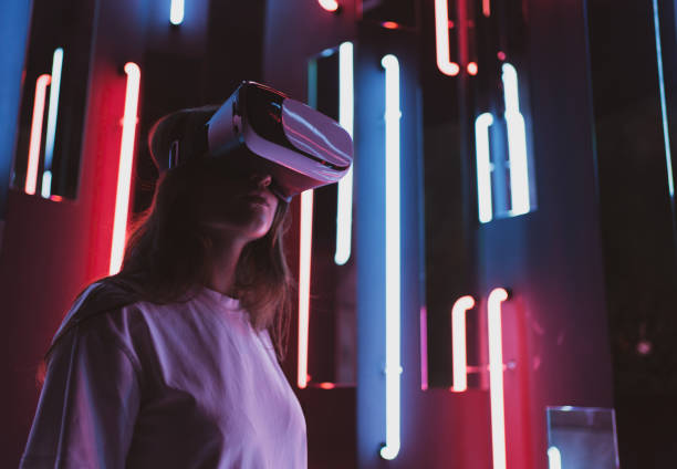istock A woman in cyberspace. Virtual reality. Playing in a helmet 1328645917