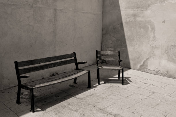 valencia spain july 19 - 2016 park benches by a house wall in valencia