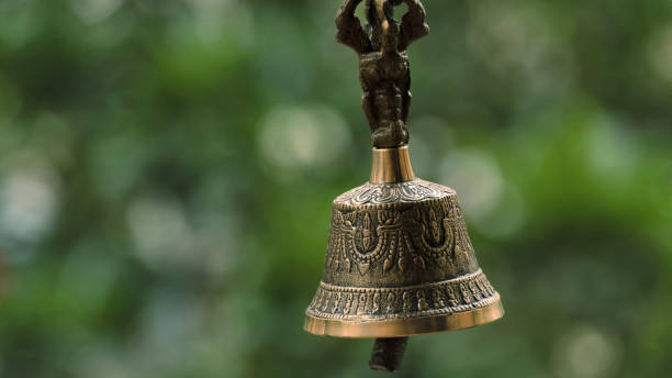 istock Bronze Bell with leaves in background 1328647226