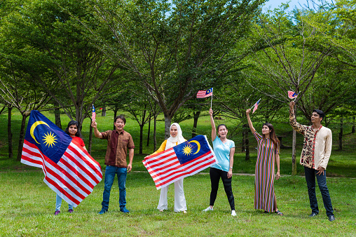 Malaysia three major multi ethnic groups comprising of Malay, Chinese and Indian have high patriotism spirit celebrating Hari Merdeka on 31st August at public park, Kuala Lumpur Malaysia.