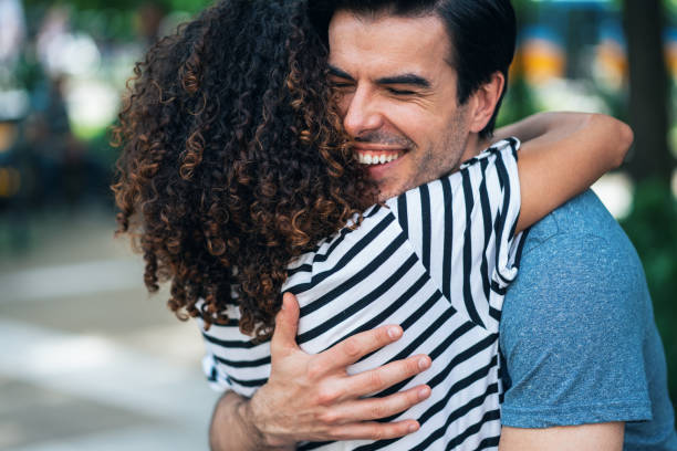 istock Couple hugging outdoors 1328650163