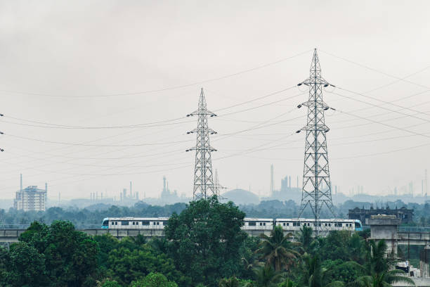 Kochi metro A wide shot of kochi metro moving through the track on a foggy morning pic was taken on 11 April 2021 at kochi India kochi india stock pictures, royalty-free photos & images