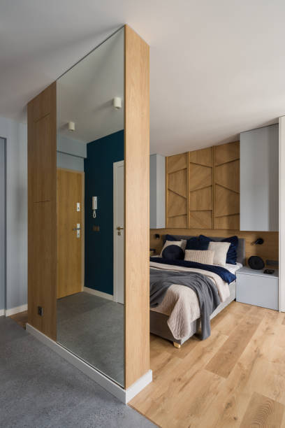 istock Bedroom behind wooden wall with mirror 1328651042