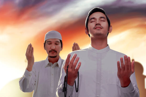 istock Two Asian Muslim men praying with prayer beads on their hands 1328651372