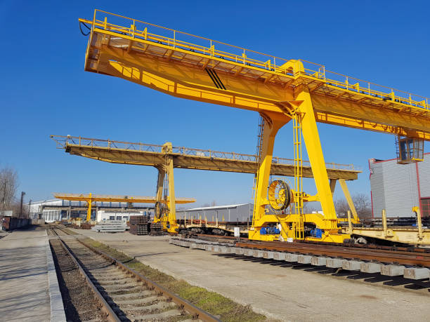 istock Factory overhead crane with electromagnetic beam on a yellow beam. Close up 1328651425