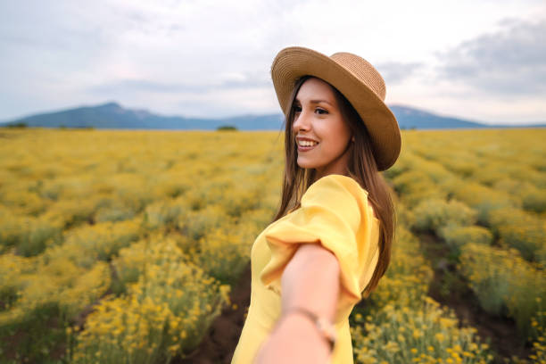 istock Woman is having fun in the field 1328654070