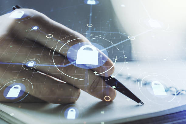 istock Creative idea concept with lock symbol and microcircuit illustration and with man hand writing in notebook on background. Protection and firewall concept. Multiexposure 1328654196
