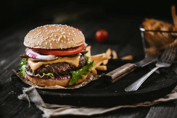 istock Delicious beef burger with french fries 1328655452
