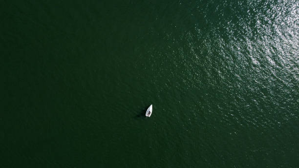 istock Aerial drone view of sailing boat on a river. 1328655707