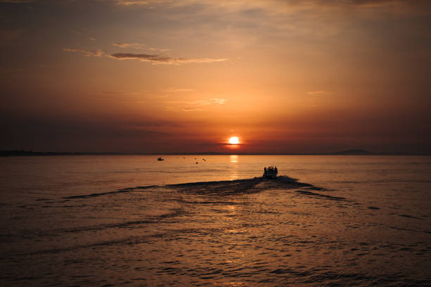 istock Sunrise on the medditerranean sea with a boat 1328656458