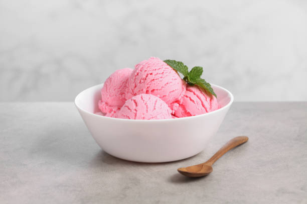 istock strawberry ice cream in white bowl on loft background 1328656590