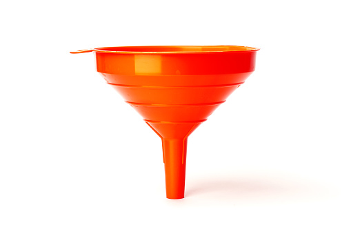 funnel isolated on white background. red plastic funnel for liquids.