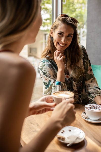 istock Relaxing women enjoying coffee together 1328663499