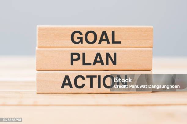 Wooden Block With Goal Plan And Action On Table Background Stock Photo - Download Image Now