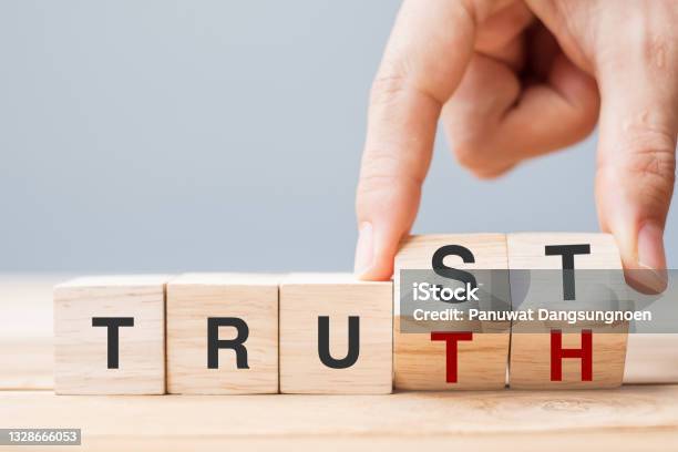 Business Man Hand Change Wooden Cube Block With Trust And Truth Business Word On Table Background Trustworthy Faith Beliefs And Honesty Concept Stock Photo - Download Image Now