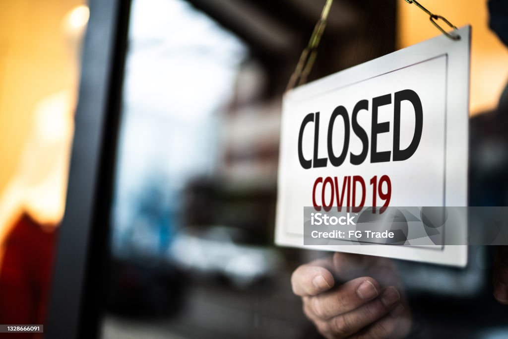 Closed sign on a store window Closed Stock Photo