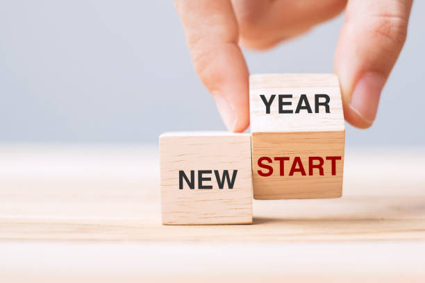 istock hand flip wooden block with New Year to New Start text on table background. Resolution, strategy, solution, goal, business and holiday concepts 1328666253